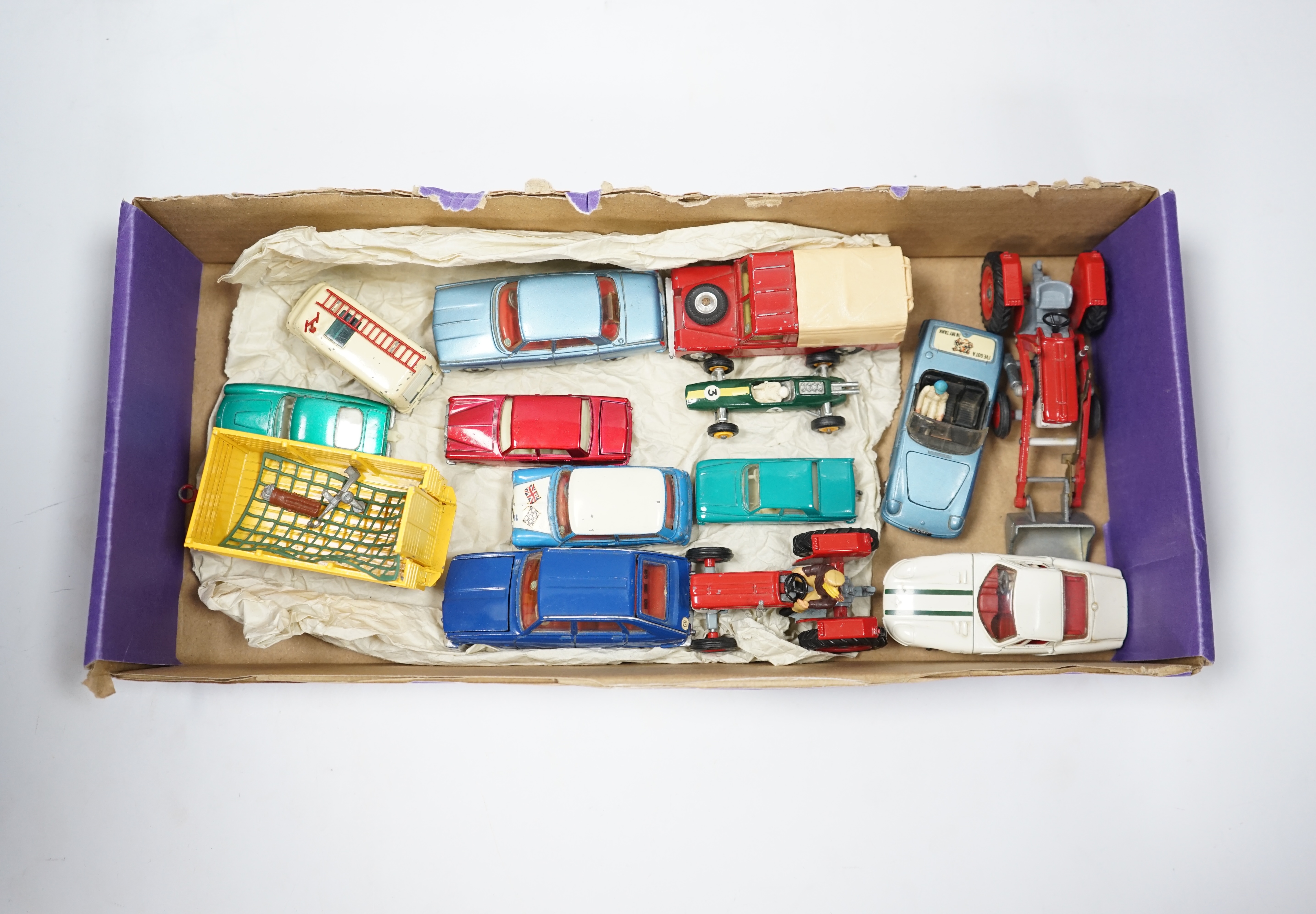 A collection of Corgi Toys and Matchbox series diecast vehicles, including a Lotus Elan 2, with ‘Tiger In My Tank’ decal, a Volvo P1800, Morris Mini Cooper, a Land Rover, a Rover 2000, a Massey Ferguson tractor shovel, e